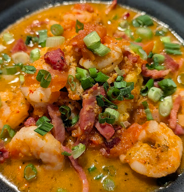 Slightly North of Broad Restaurant signature dishes Carolina Shrimp & Grits
Pan Seared New Bedford Scallops
Grilled Allen Brothers 16oz Prime Ribeye